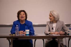 SFS Professor Emerita Angela Stent and Adjunct Professor Jill Dougherty sit at a table.