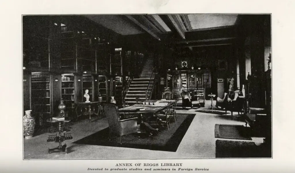 Archival black and white photograph of a library. Text: Annex of Riggs Library - Devoted to graduate studies and seminars in Foreign Service