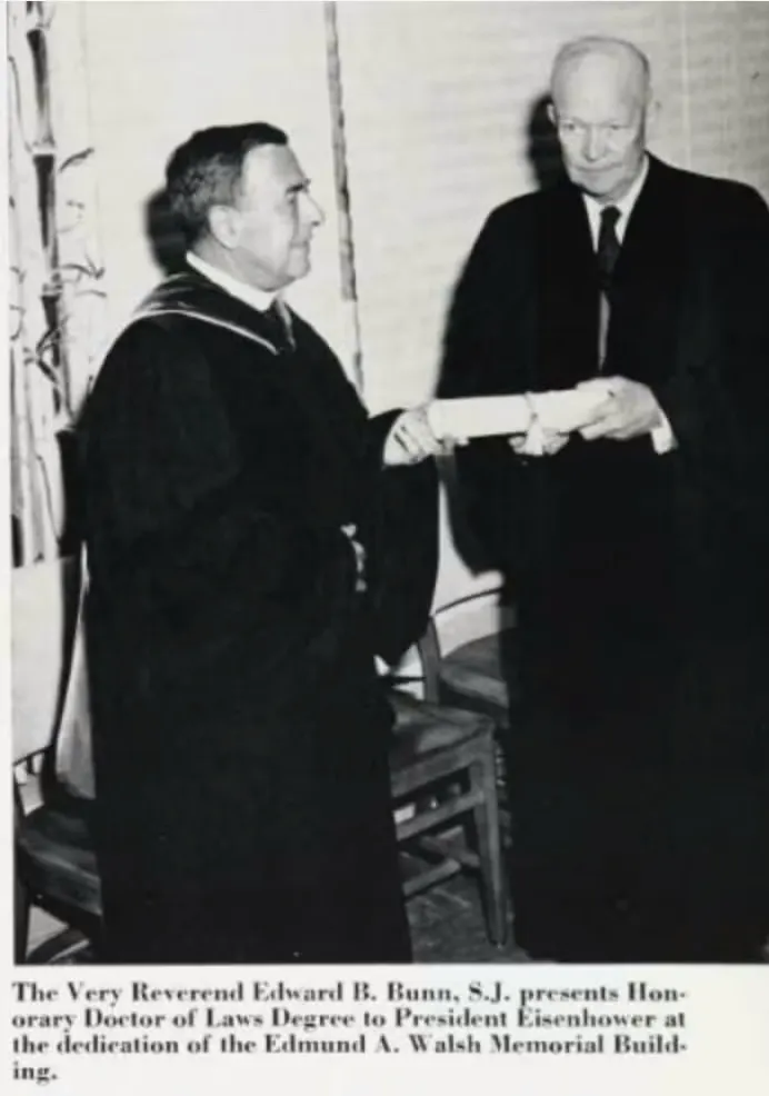 The Very Reverend Edward B. Bunn, S.J presents Honorary Doctor of Laws Degree to President Eisenhower at the dedication of the Edmund A. Walsh Memorial Building.