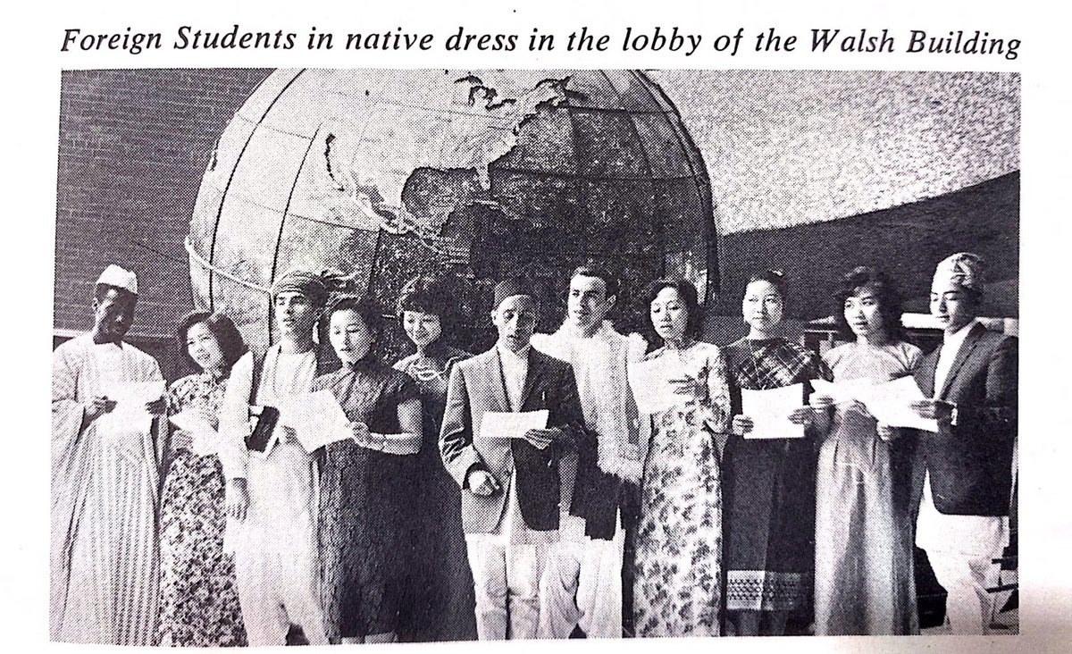 International students donning their native dress at the Walsh Building, including Asian, African and Middle Eastern.