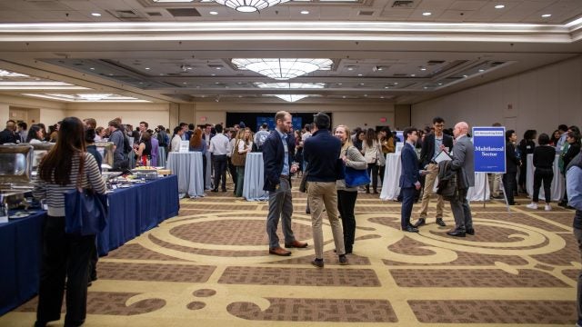 Students and alumni mingle at the SFS Networking Reception