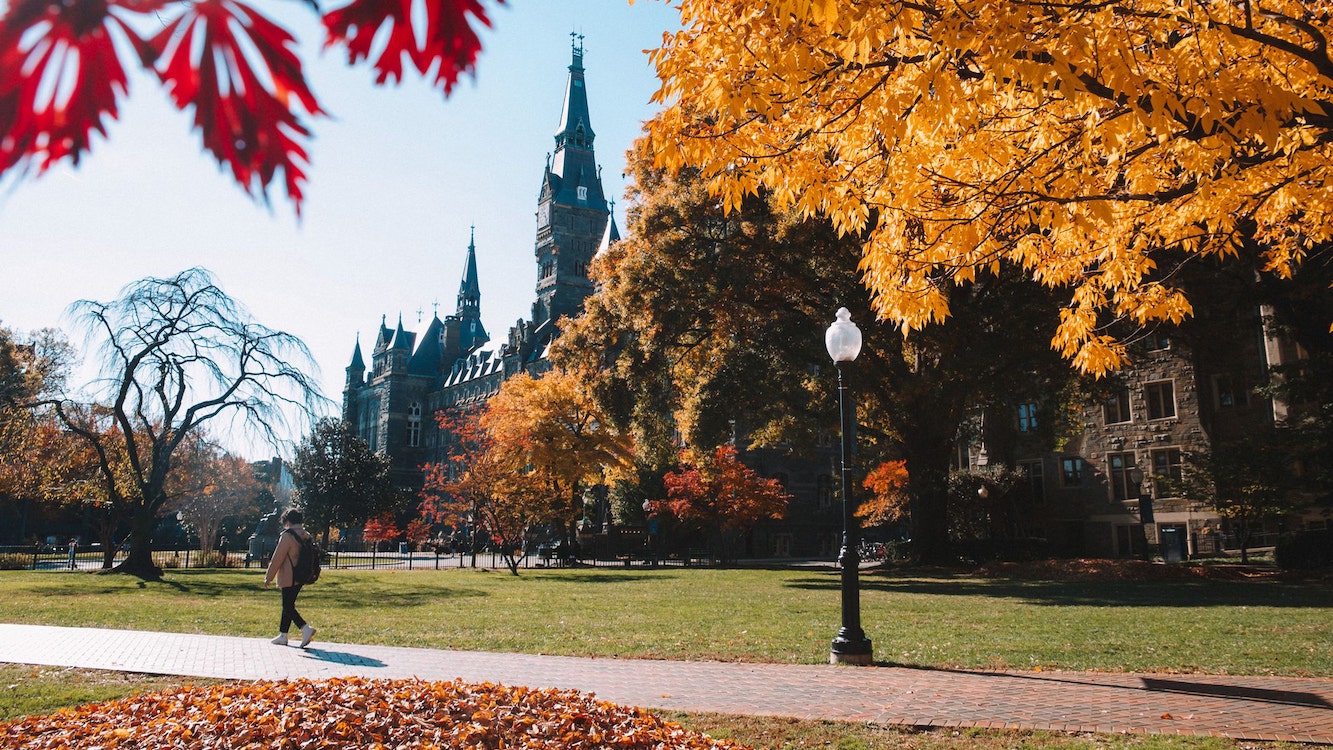 Healy Hall in the fall surrounded by fall foliage.