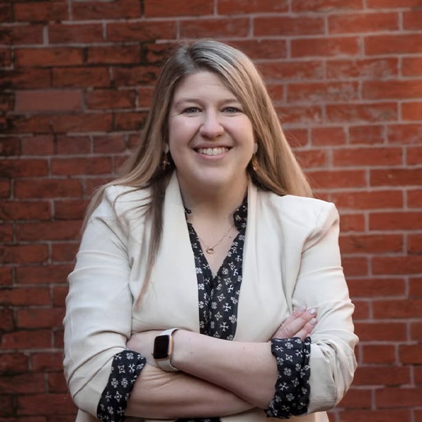 Headshot of assistant dean Shawna Julia smiling
