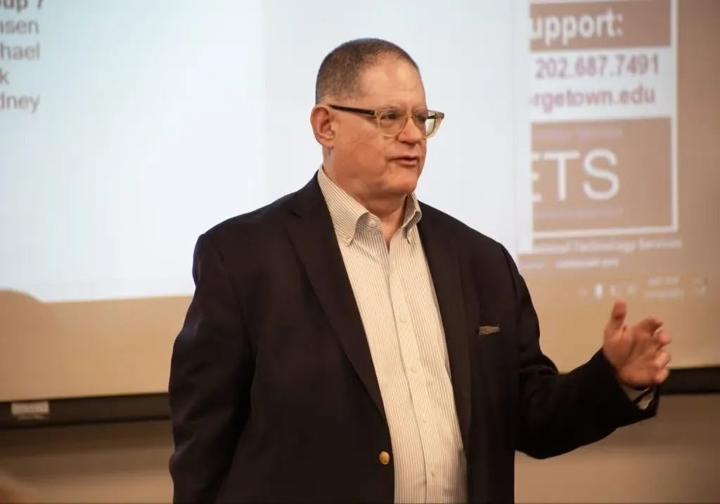 Visner addressing his students while teaching STIA 391