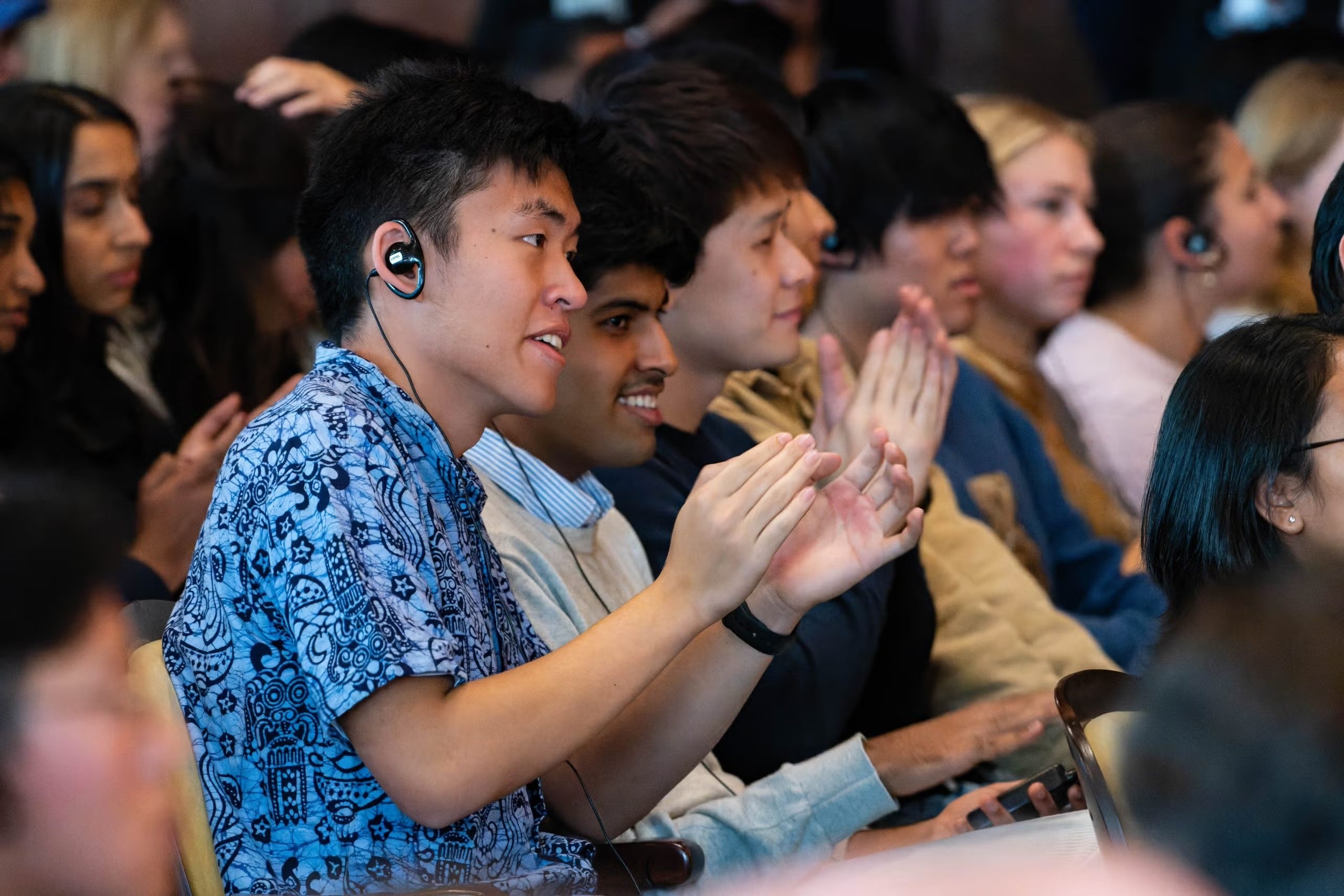Audience members in Gaston Hall.