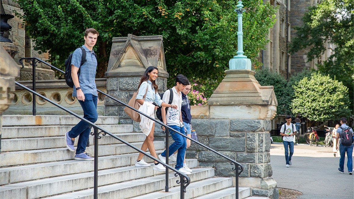 Students going down the Healy stairs
