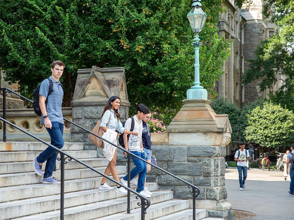 Students going down the Healy stairs