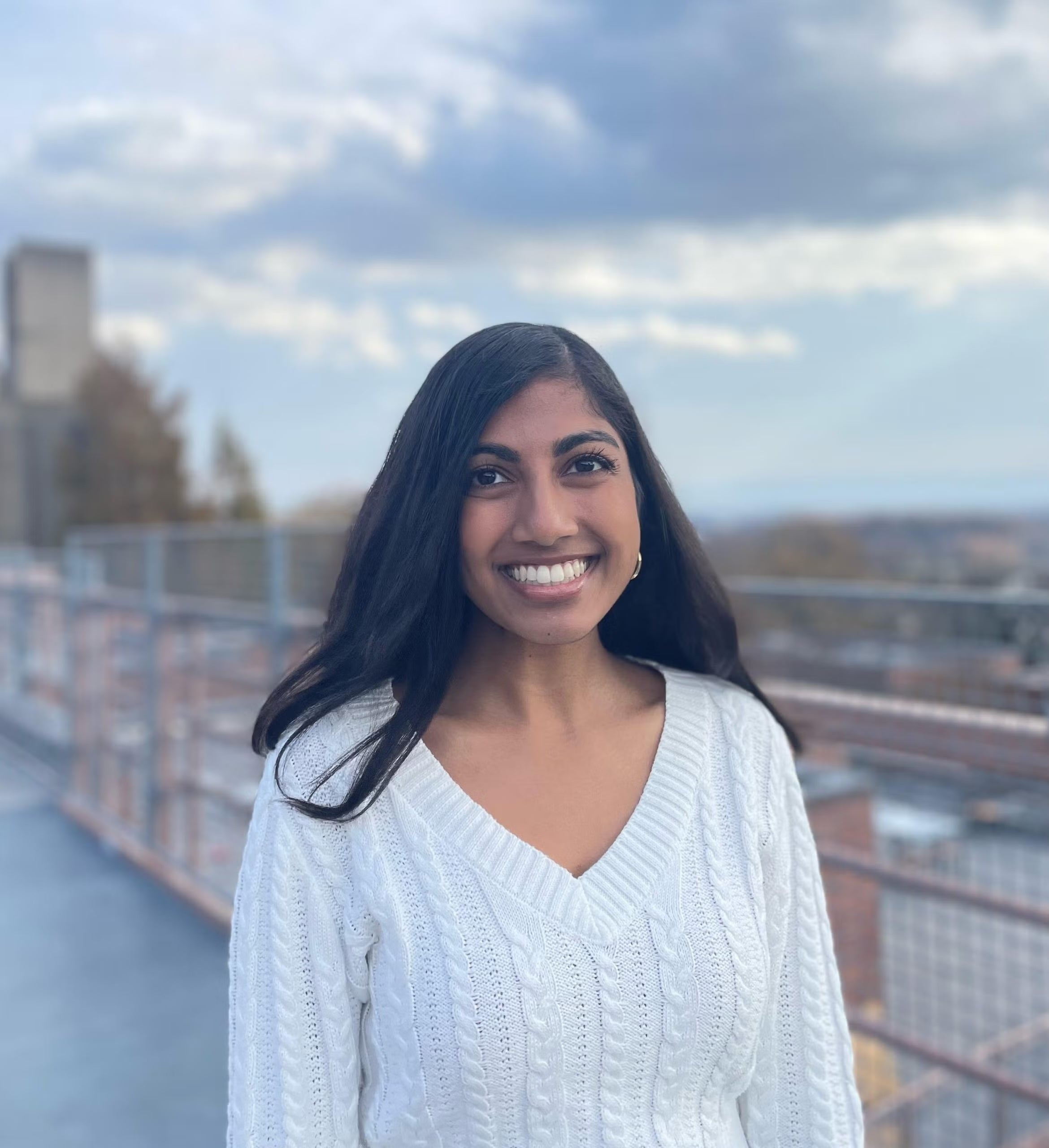 Cimrun Srivastava standing on Georgetown Village Rooftop.