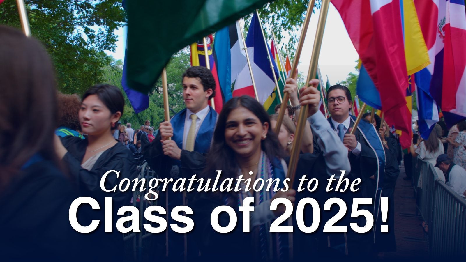 Group of graduates holding various international flags at a celebration, with the text &#039;Congratulations to the Class of 2025!&#039;