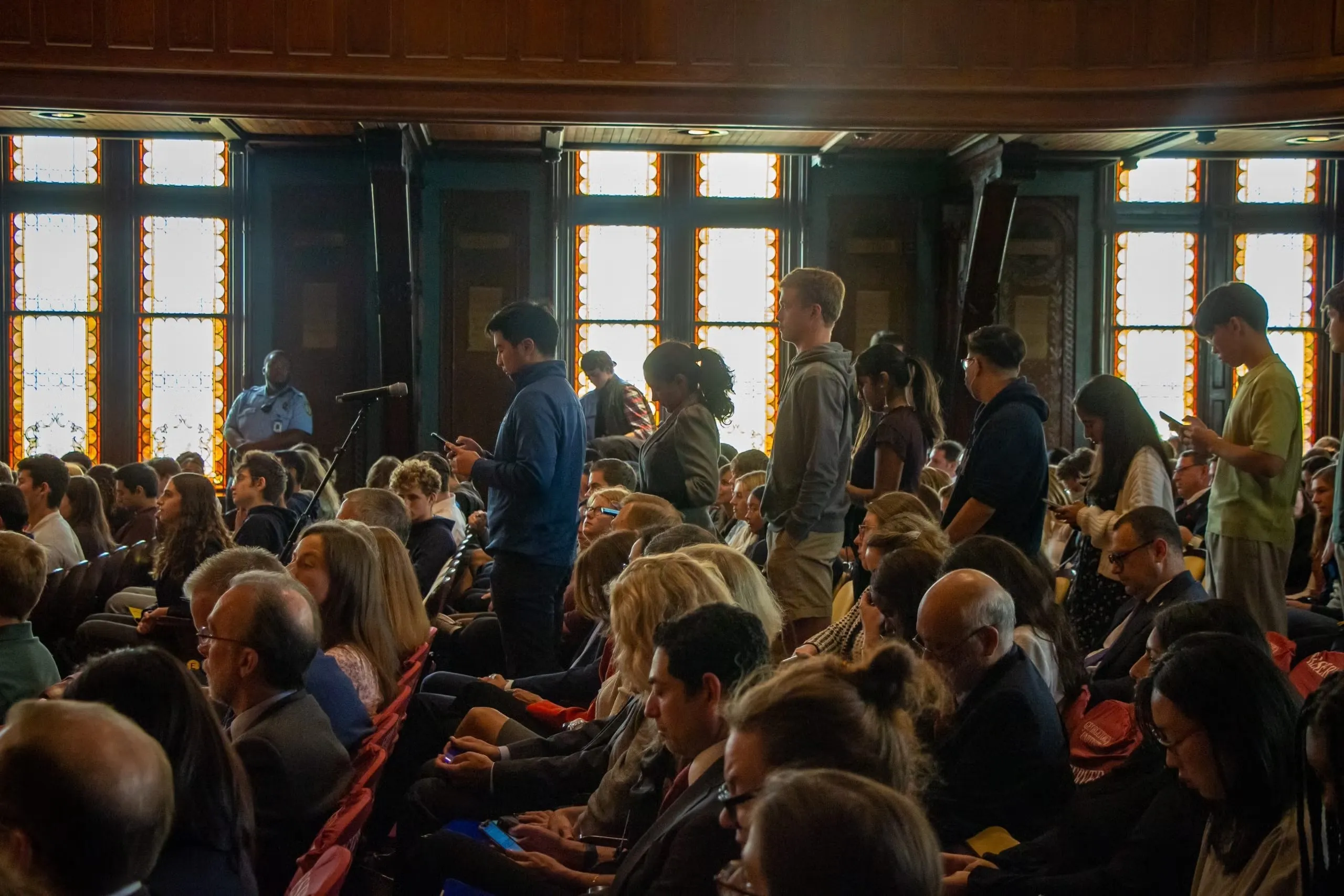 Students line up to ask questions during the Q&A session.