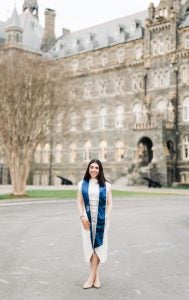 Sophia Athan (MAGES'25) stands in front of Healy Hall.