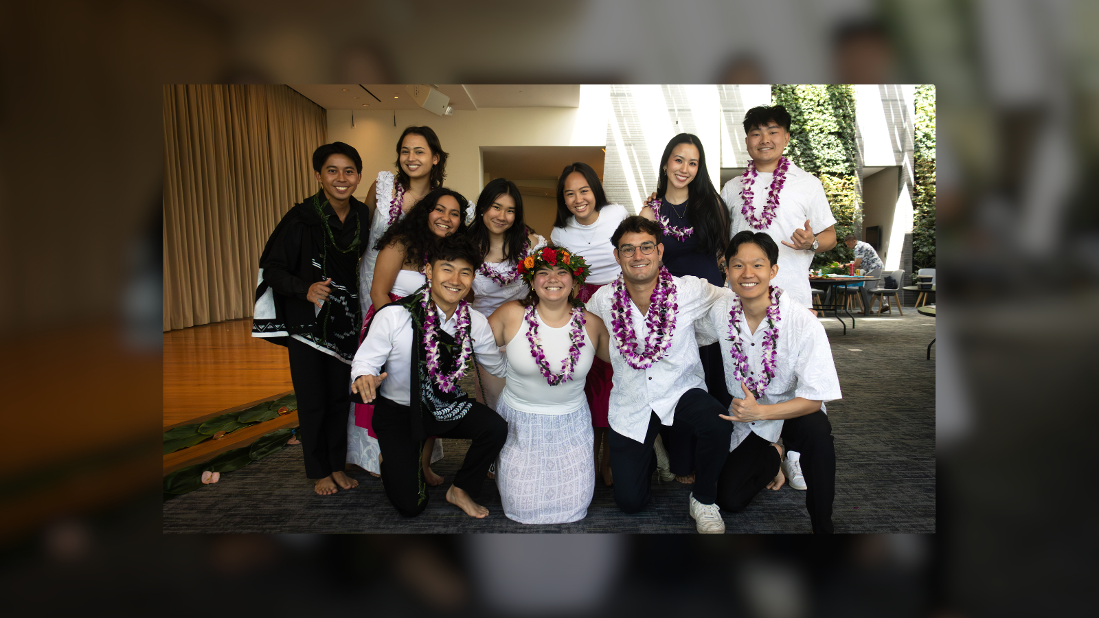 Luka Wohl poses with a group of people all wearing lu&#039;aus.