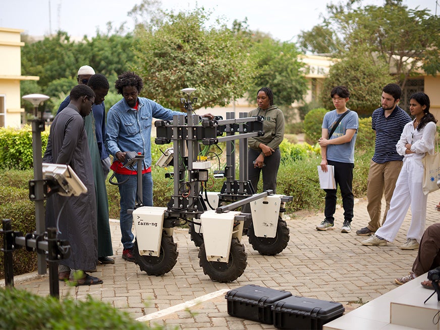 Students getting a demonstration of robotics in Senegal