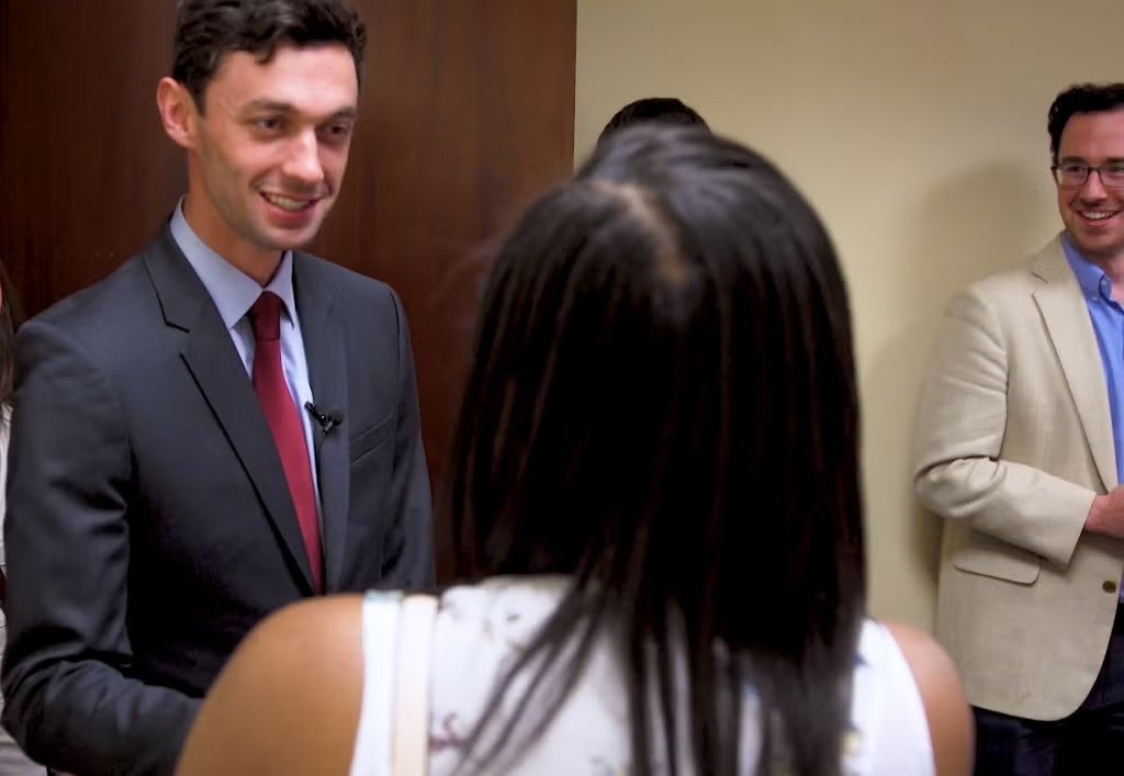 Jon Ossoff shaking hands with SFS student