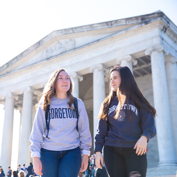 Georgetown students walking in front of Lincoln Memorial