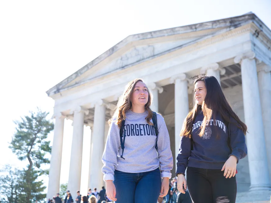 Georgetown students walking in front of Lincoln Memorial