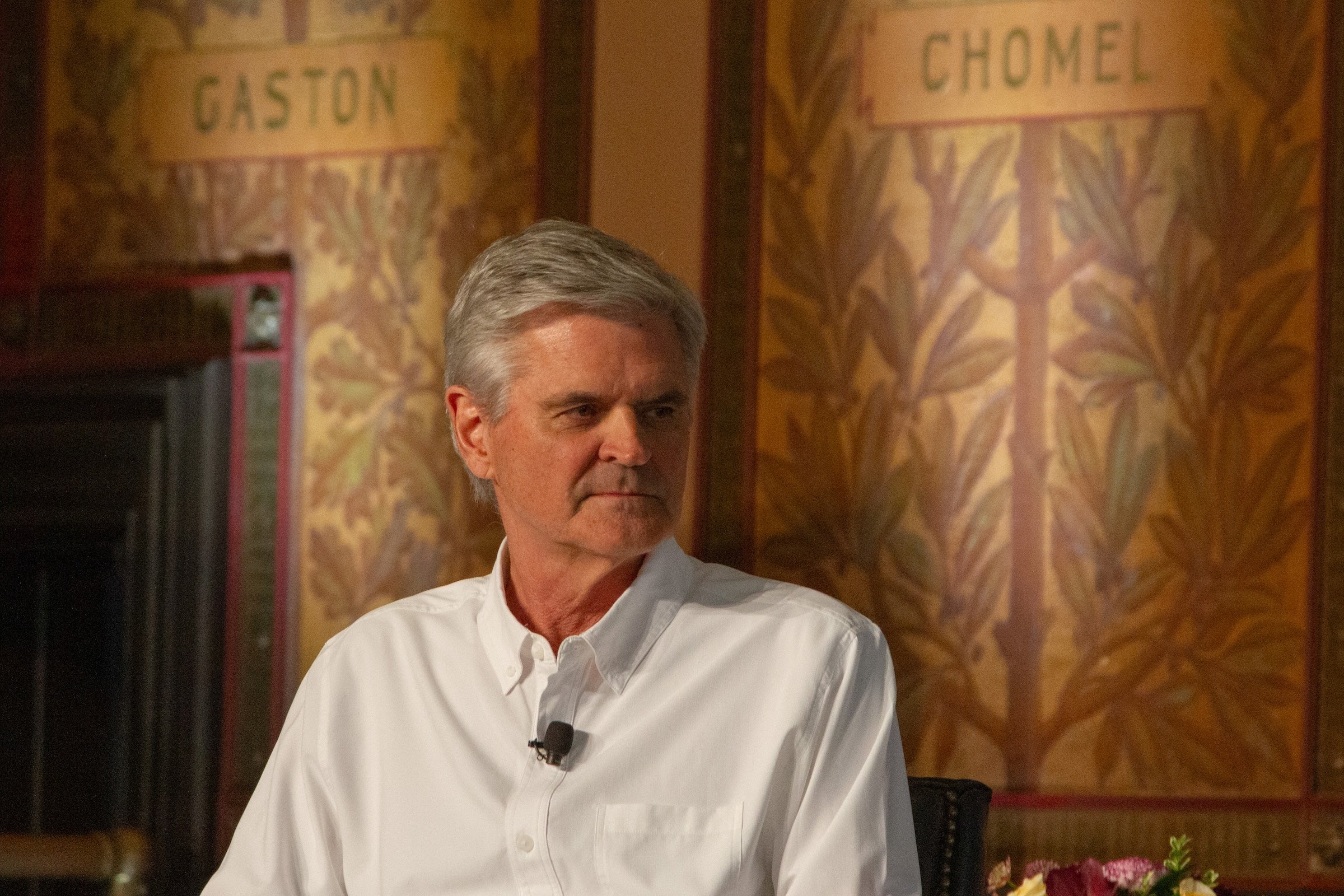 Steve Case sits in a chair onstage.