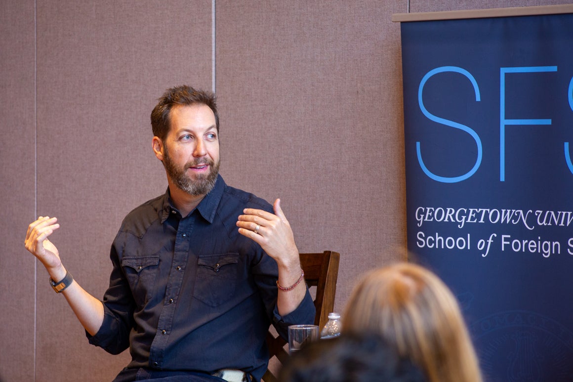 Chris Sacca sitting down speaking to an audience, behind him a banner for SFS Georgetown School of Foreign Service