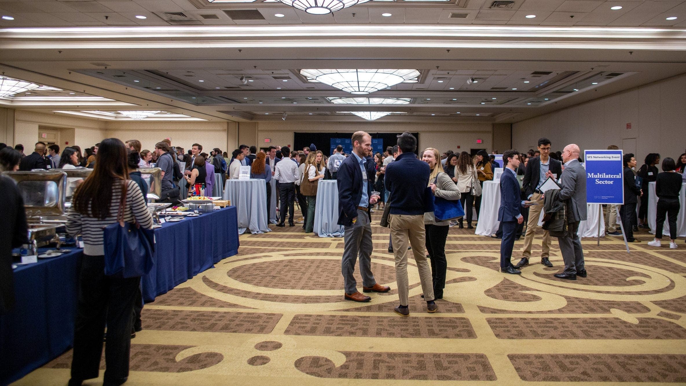 Students and alumni mingle at the SFS Networking Reception