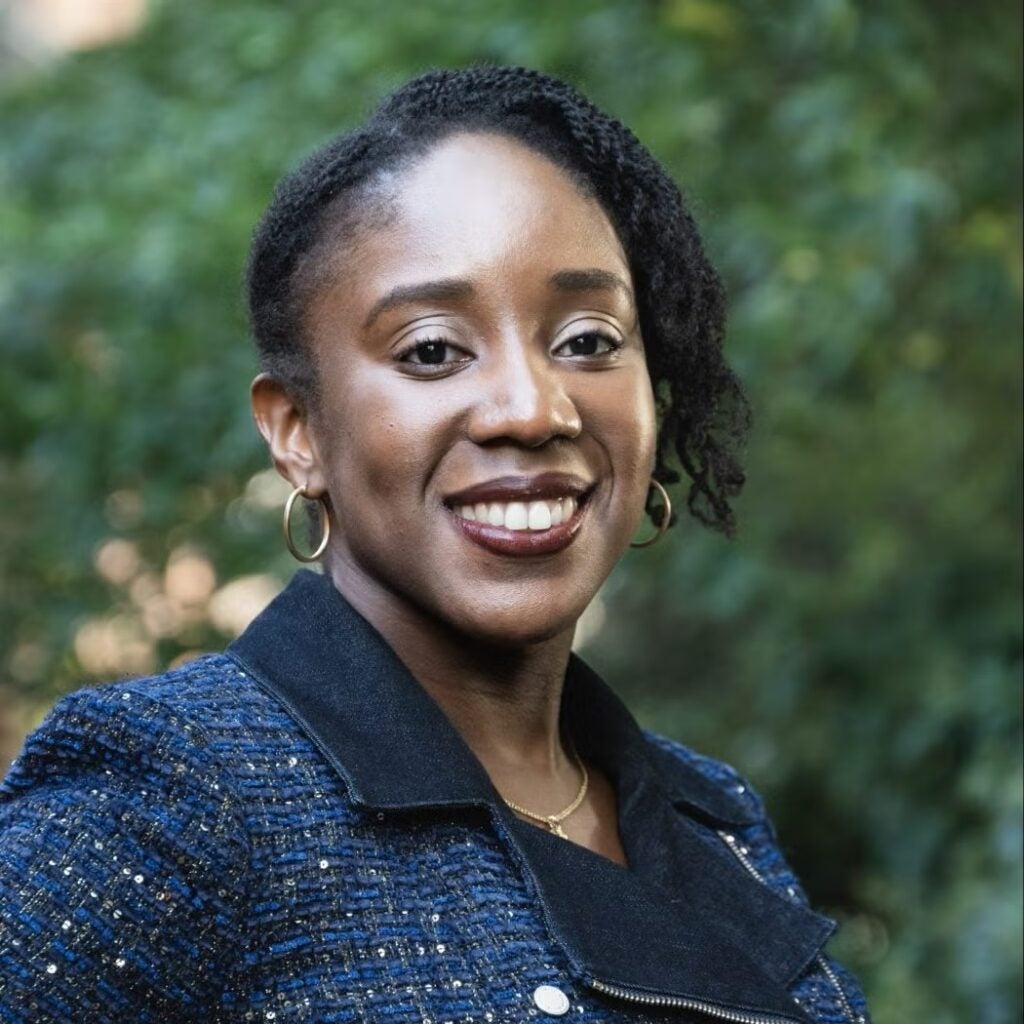 Abayomi Edwards-Dyer wearing a navy blue plaid jacket.