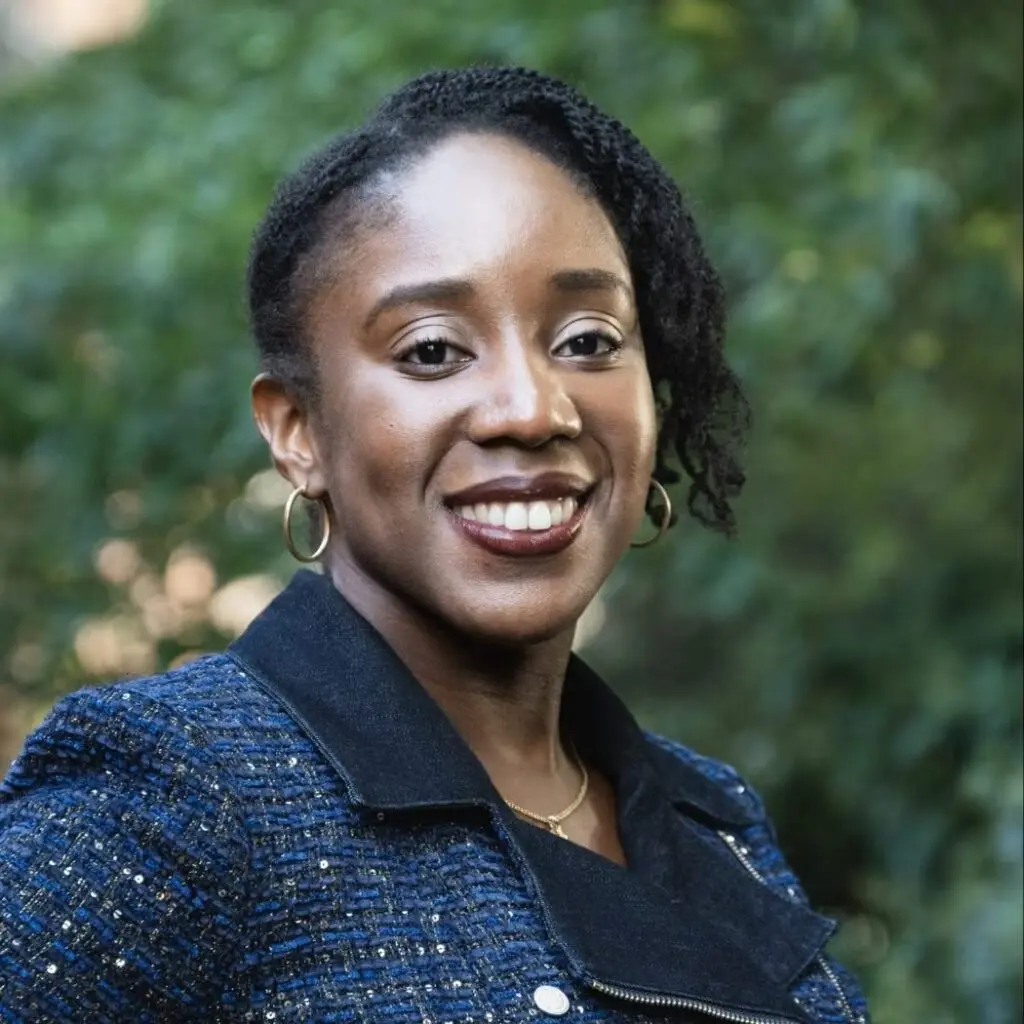 Abayomi Edwards-Dyer wearing a navy blue plaid jacket.