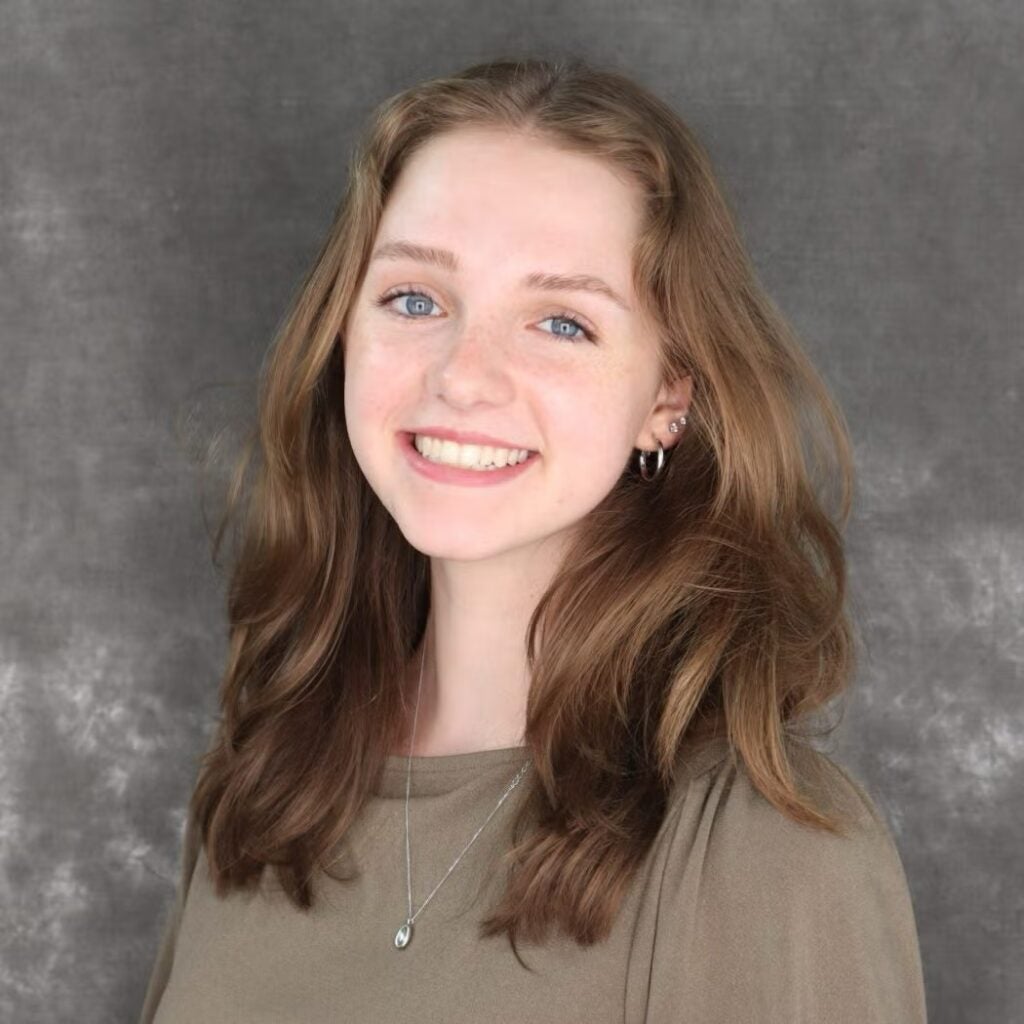 Ava Zabelski wearing a tan shirt.