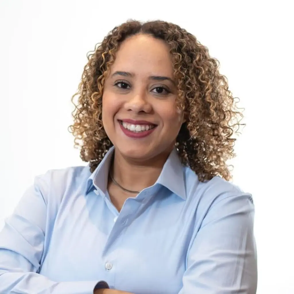 Barbara Ferreira Santos wearing a light blue button-down shirt.