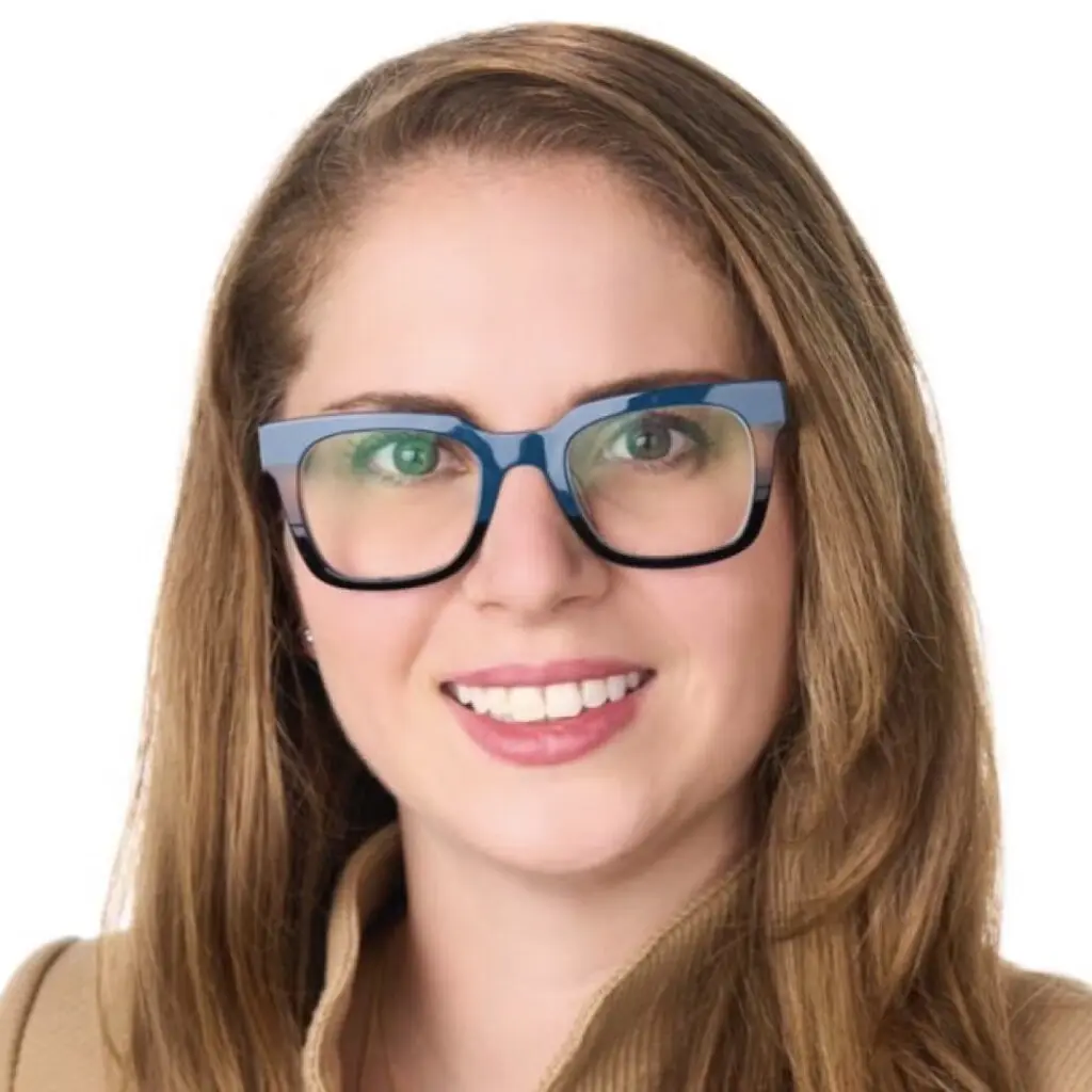 Charlene van Dijk wearing a tan blazer and glasses.