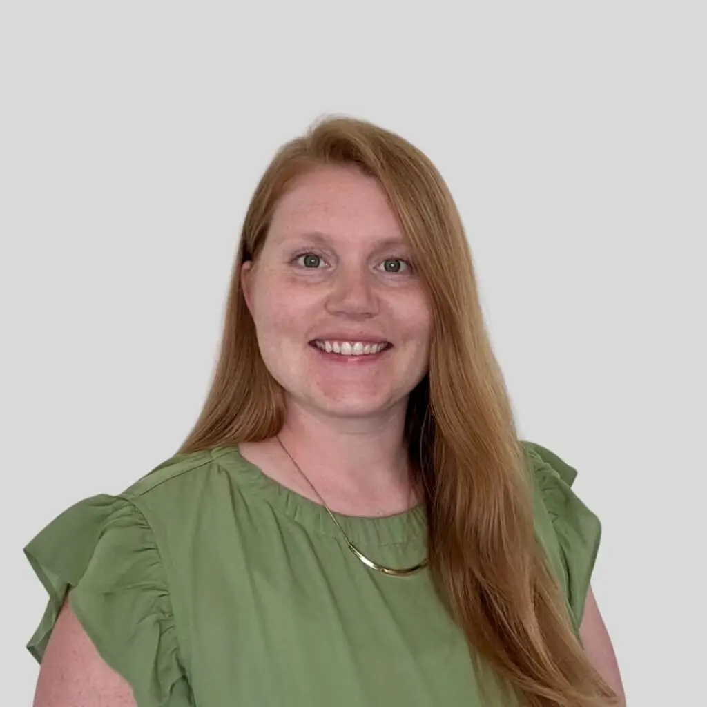 Chelsea Hollenback wearing a sage green blouse.