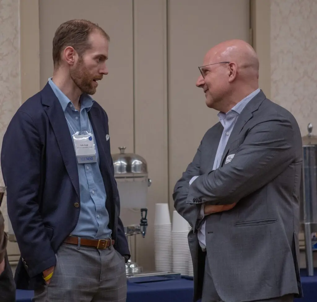 Colin Steele (SFS'12) speaks to Dean Joel Hellman at SFS Networking Reception.
