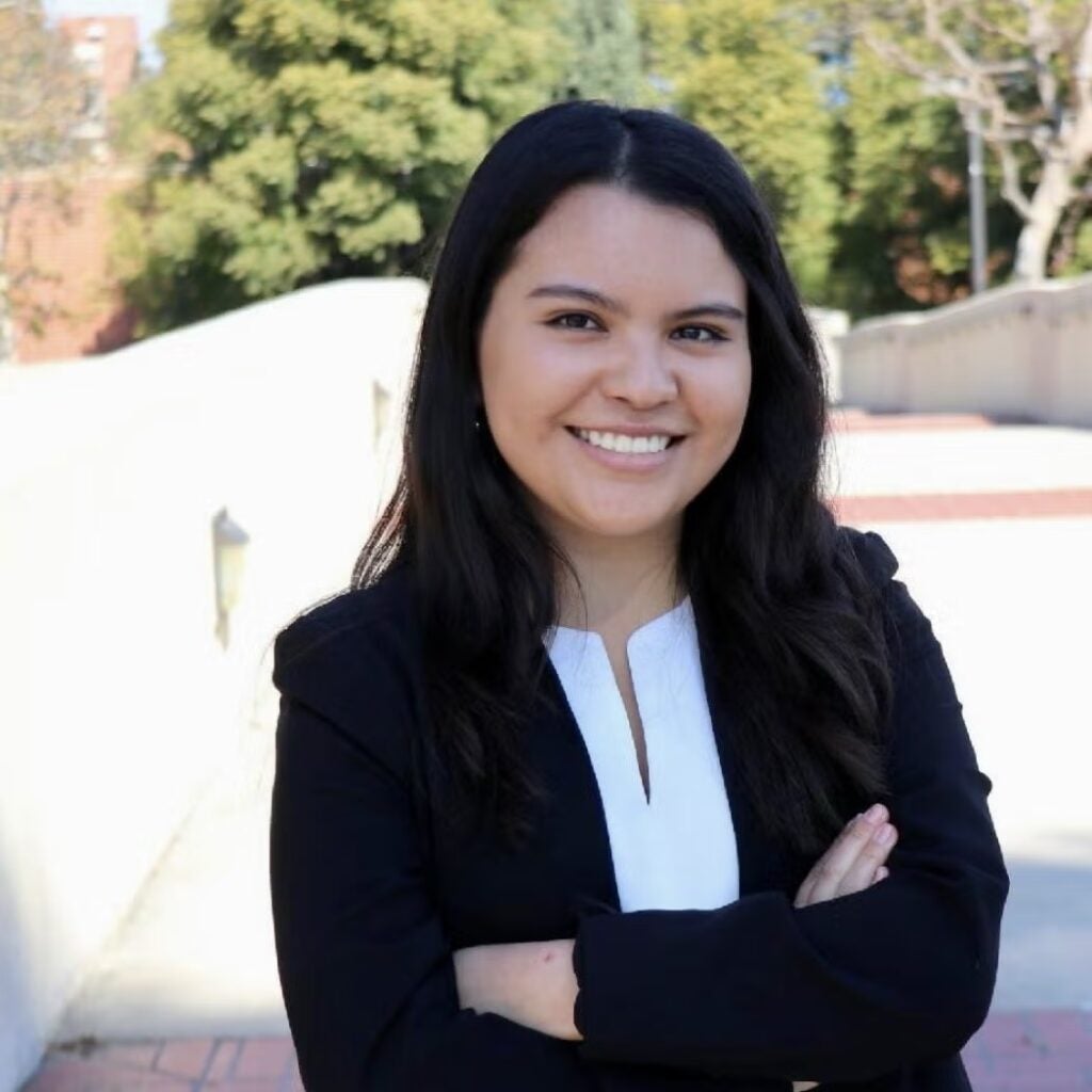 Daniella Hernandez wearing a black blazer and a white blouse.