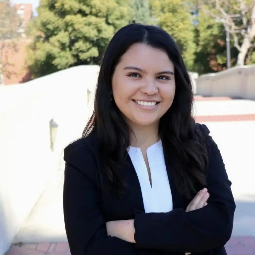 Daniella Hernandez wearing a black blazer and a white blouse.