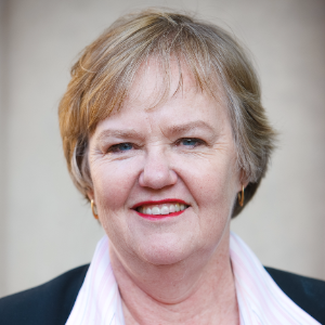Elizabeth Ferris wearing a dark blazer and white shirt.