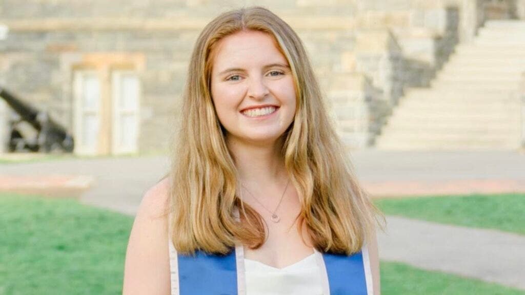 Headshot of Georgie Wilson wearing a graduation stole.