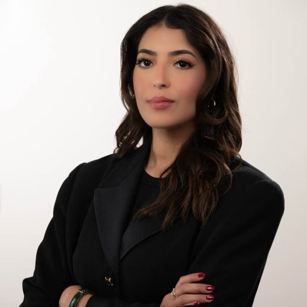 Hessa Alyahya wearing a black blazer and a black shirt.