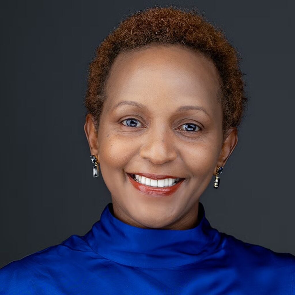 Joyce Msuya wearing a blue shirt.