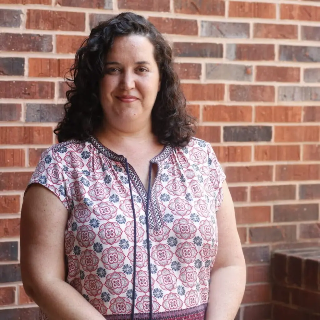Julie Walsh McMurtry wearing a patterned blouse.