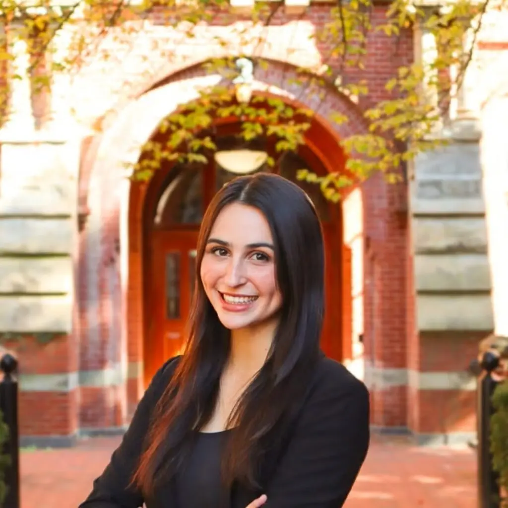 Kate Halabi wearing a black shirt and a black blazer.