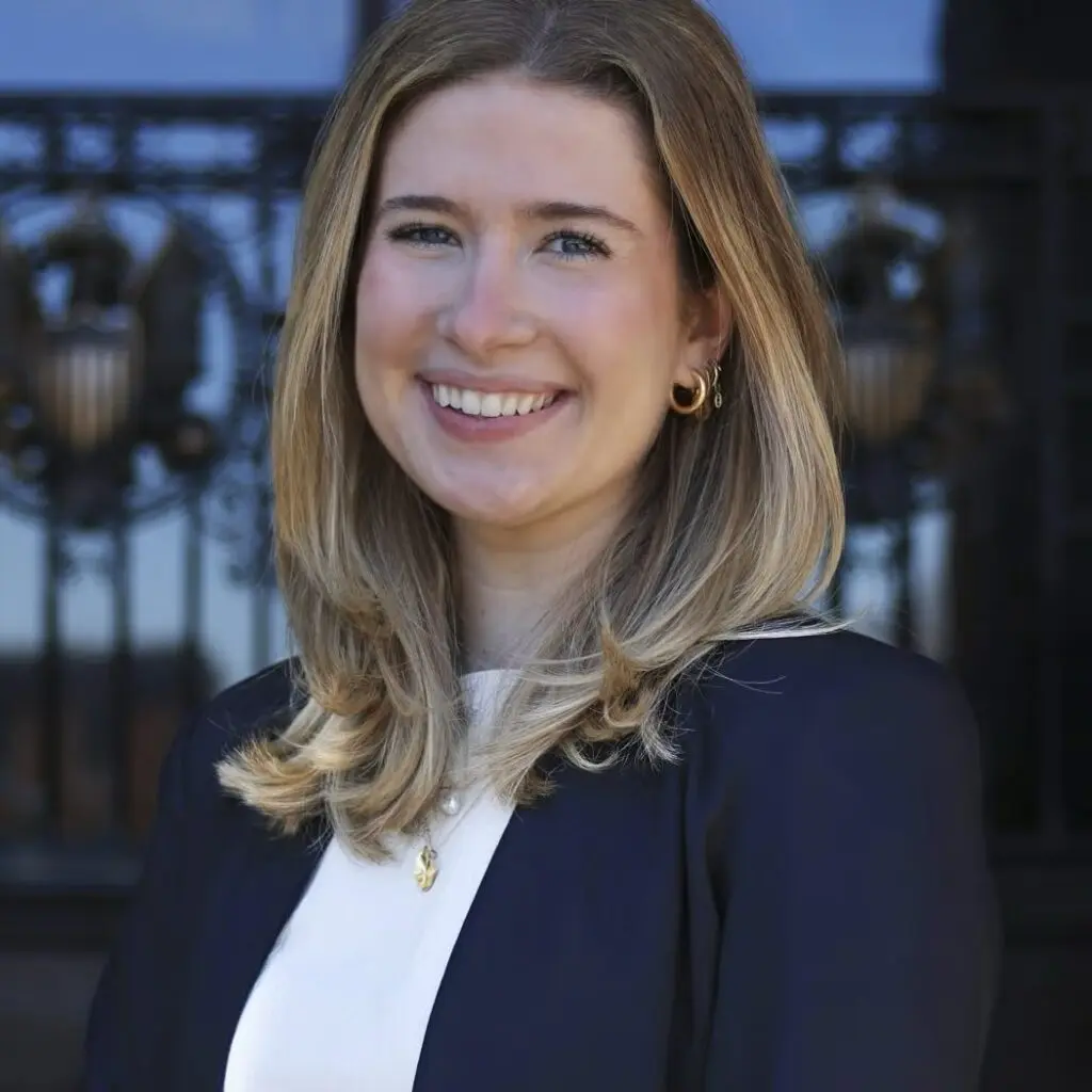 Mar Casajuana wearing a navy blazer and a white shirt.