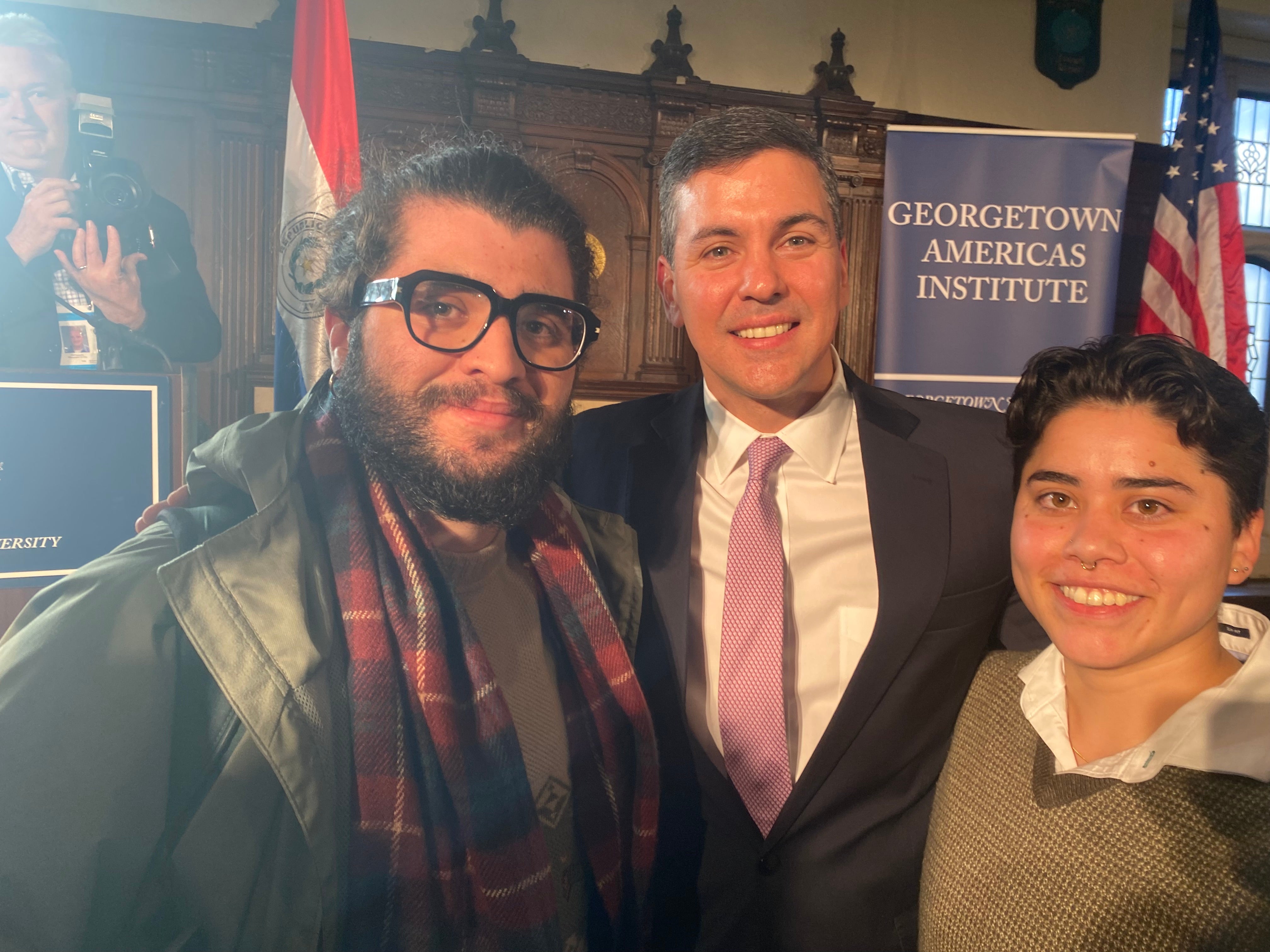 Two individuals posing with the President of Paraguay at a Georgetown Americas Institute event.