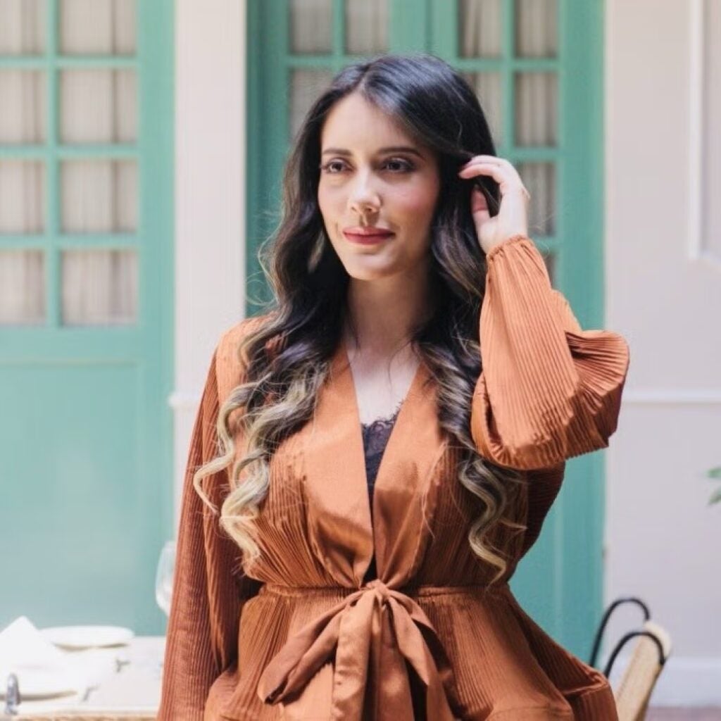 María Gabriela Murcia Fonseca wearing a burnt orange blouse.