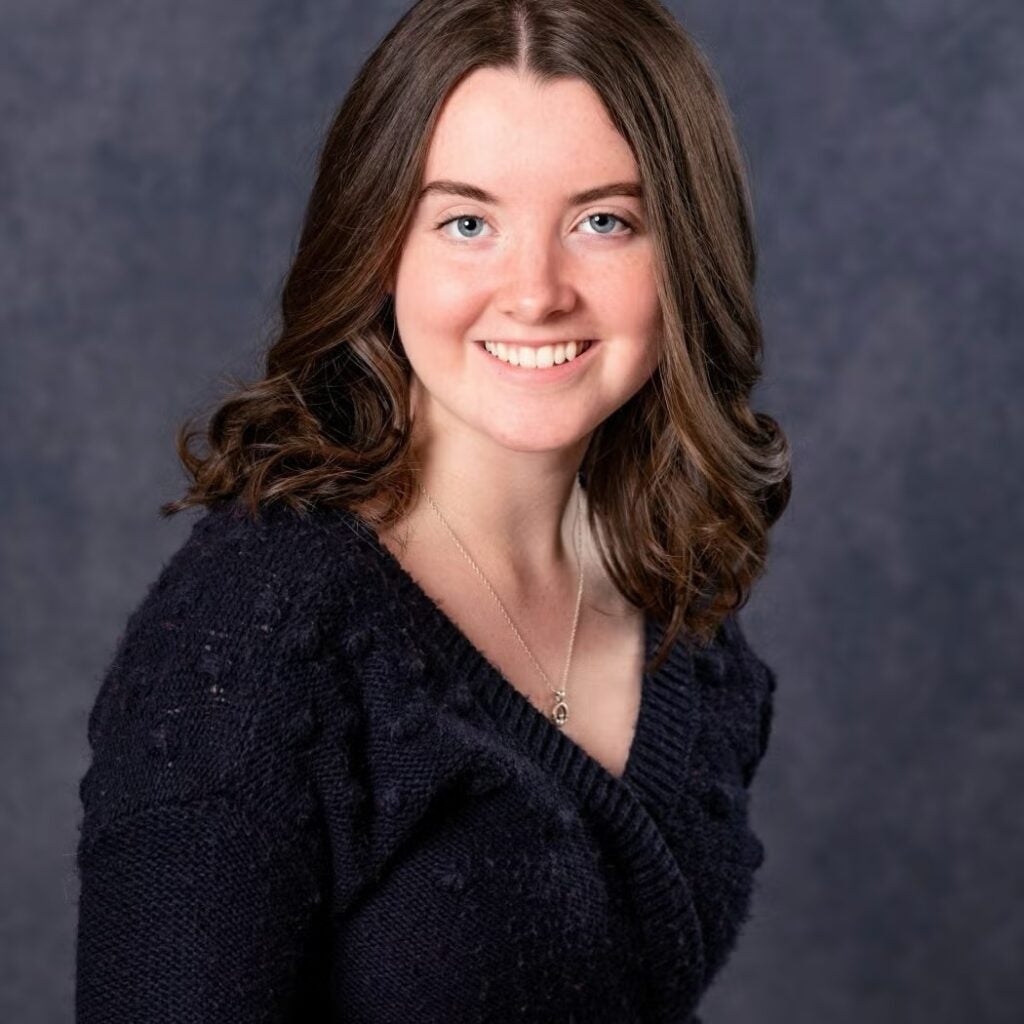 Mary McMahon wearing a dark sweat sweater.