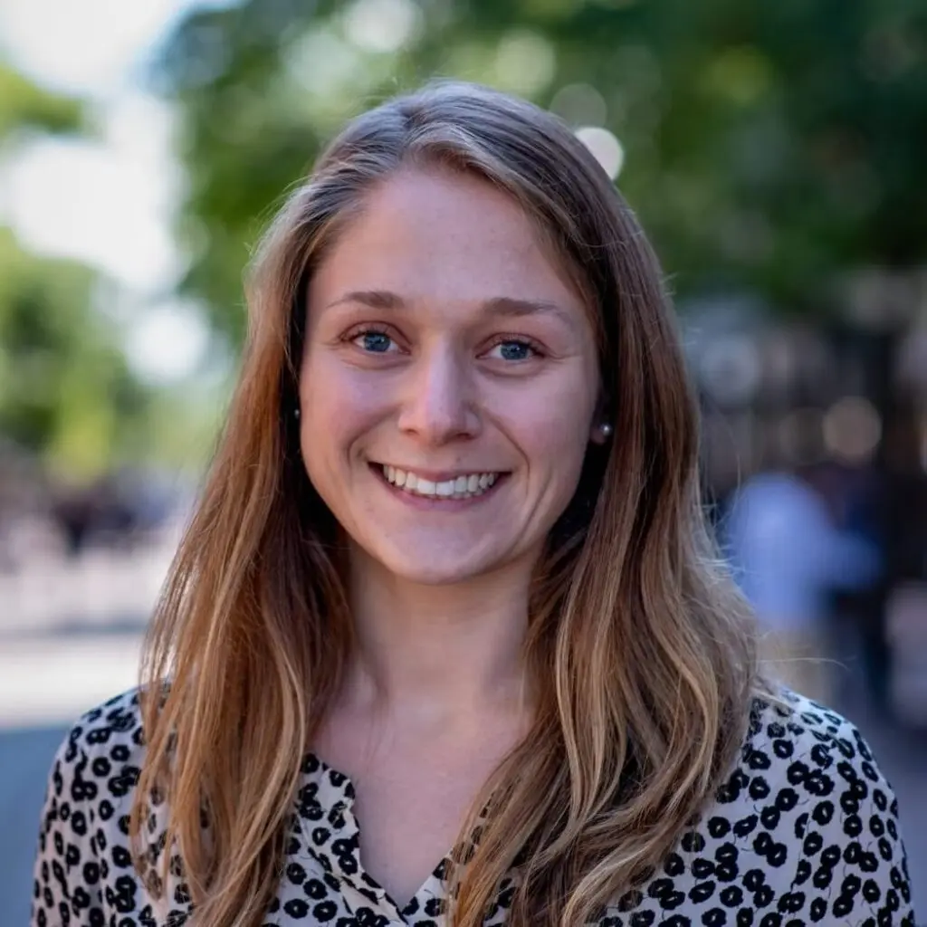 Megan Kloeckner wearing a floral blouse.