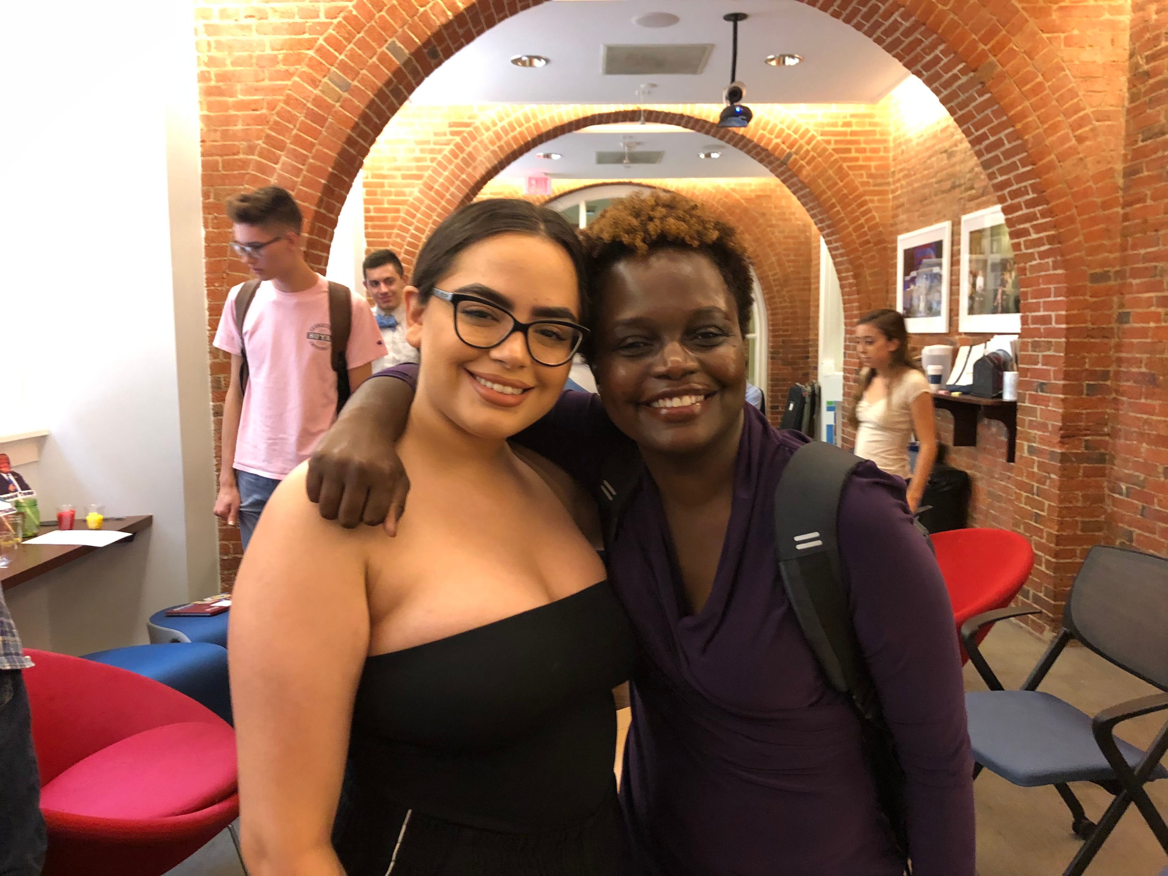 Nicole Sanchez poses with Karine Jean-Pierre in the GU Politics basement.