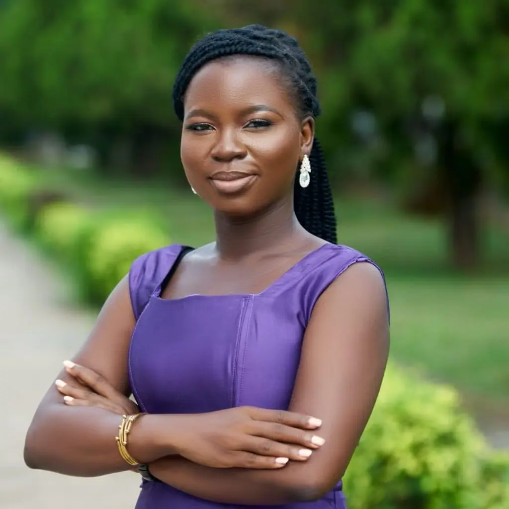 Olayinka Adedeji wearing a purple blouse.