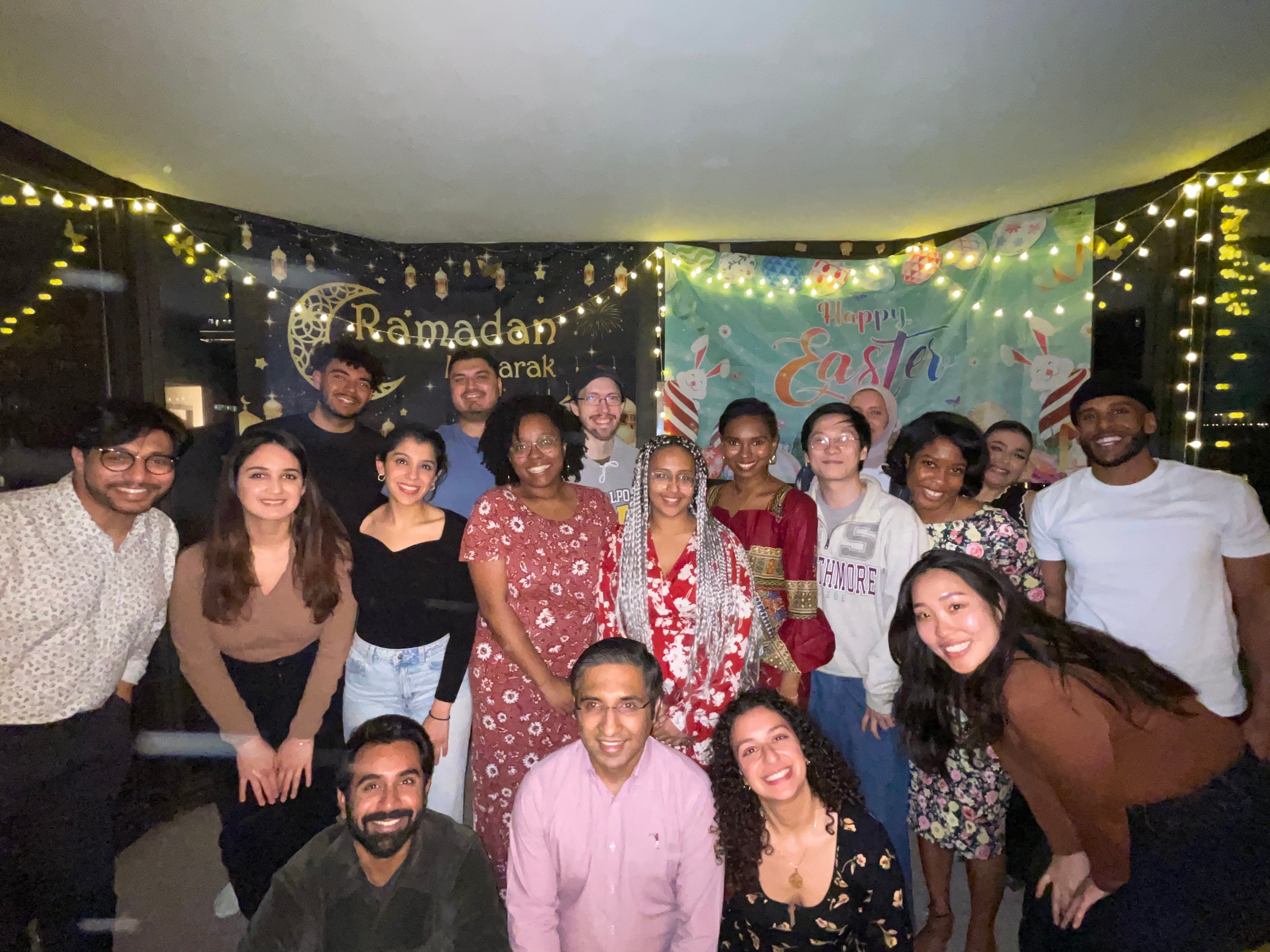Salamata Bah and her friends stand in front of two banners that say "Ramadan Mubarak" and "Happy Easter."