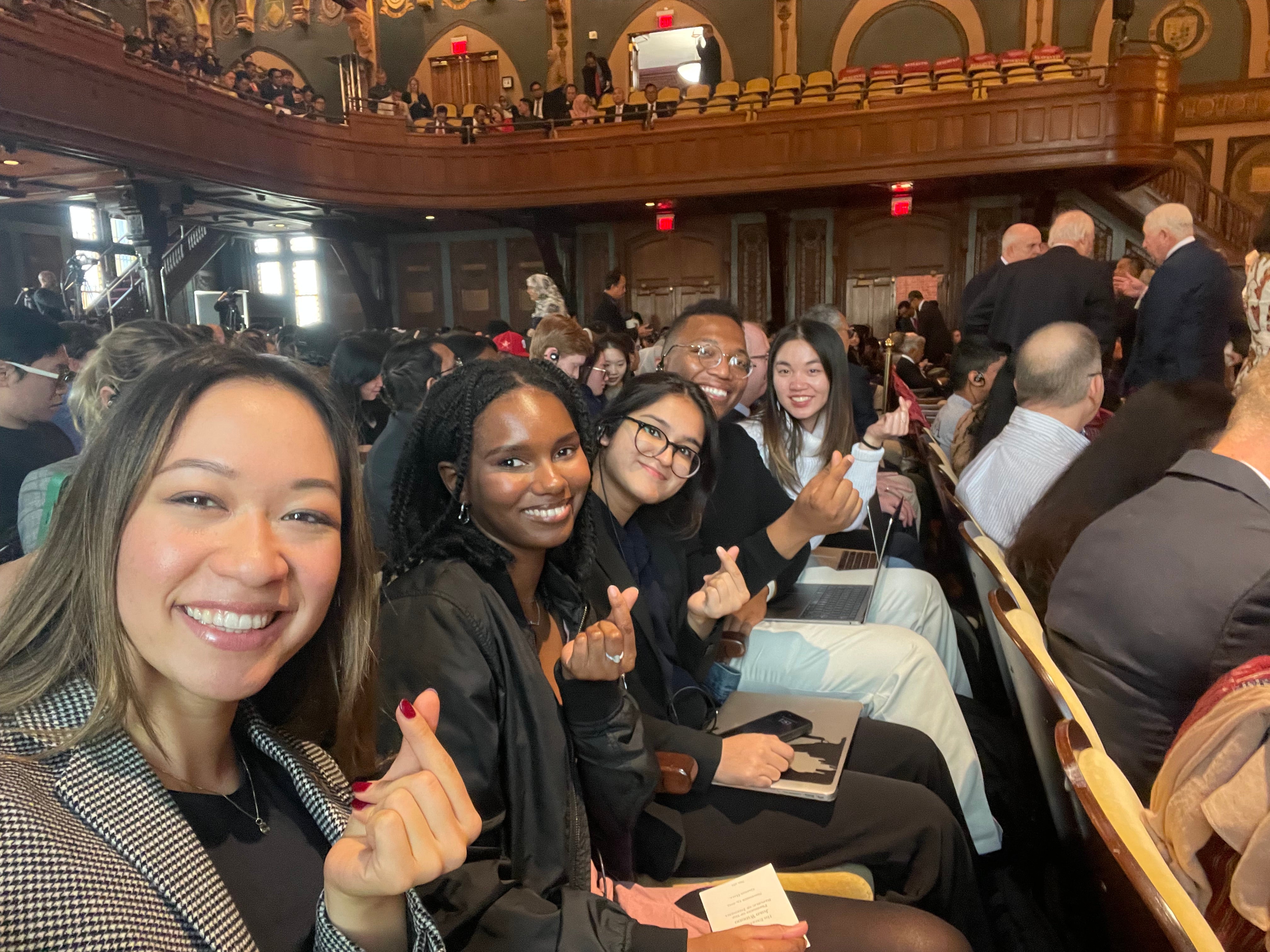 Salamata Bah sits her fellow graduate students in Gaston Hall for an event.