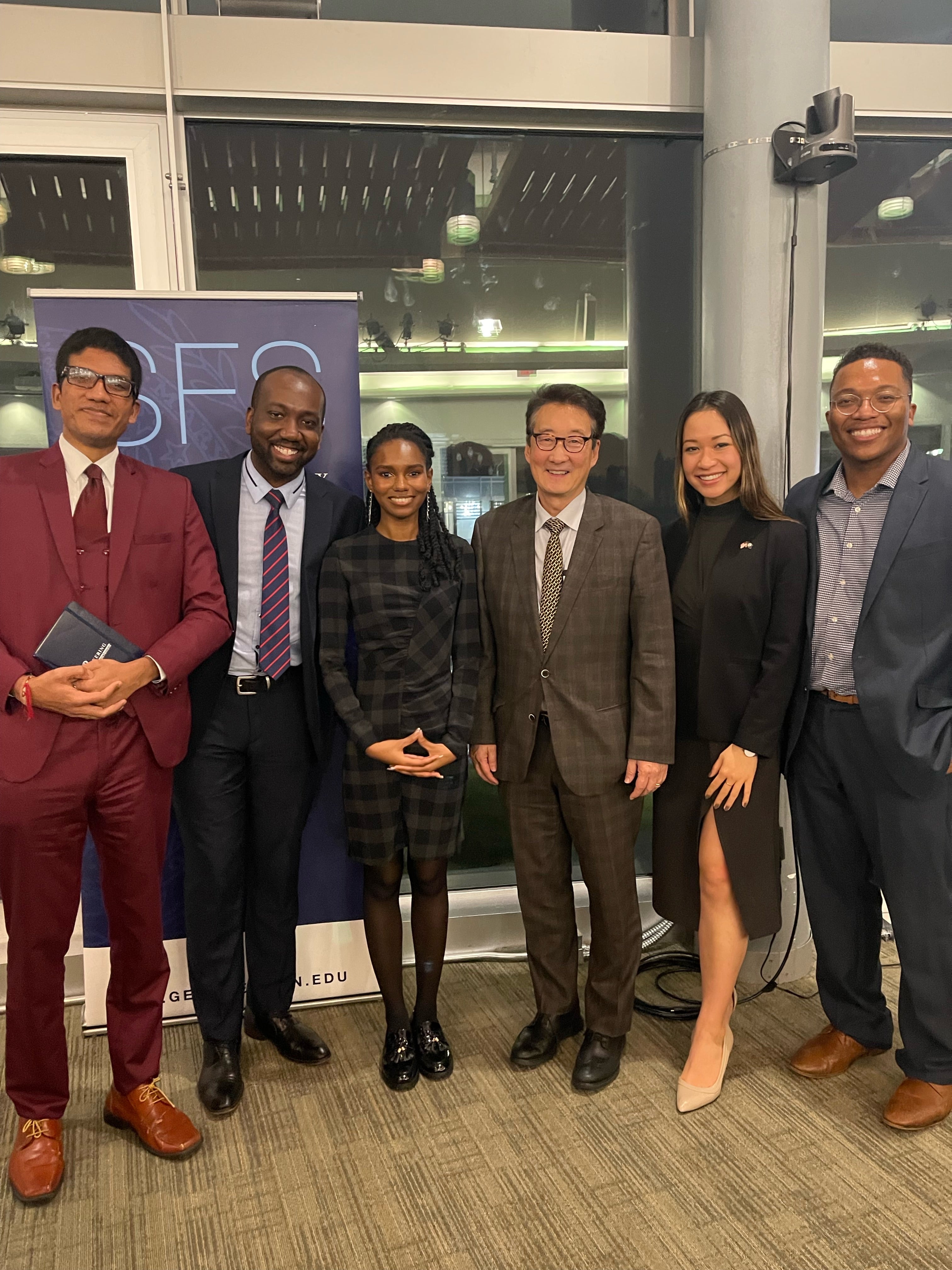 Salamata Bah and her friends pose with Professor Victor Cha at a holiday party.