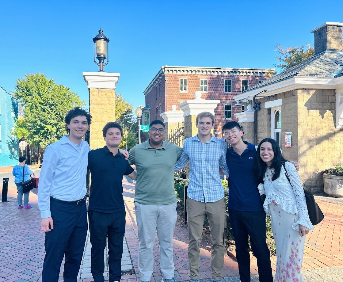 Sam Li and five classmates pose in Healy Circle.