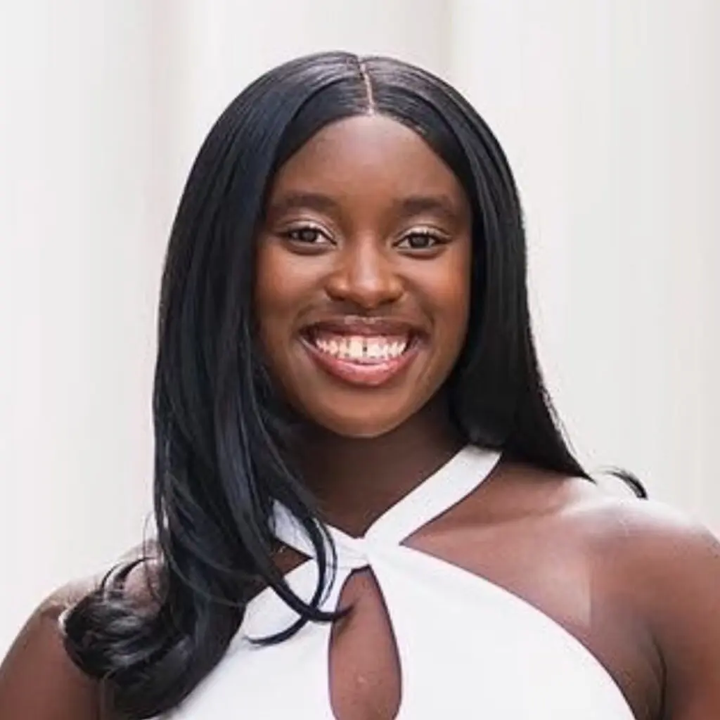 Shekina-Shindano wearing a white blouse.